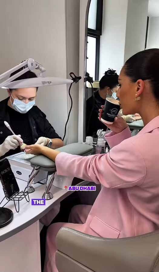 Two technicians working at the nail stations